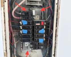 Paint overspray coating breakers and busbars inside an electrical panel