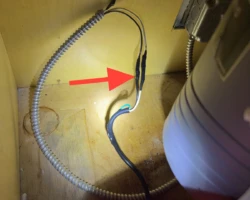 Food Waste Disposal – Wiring Spliced Outside a Box Exposed wire splice with no junction box in the cabinet beneath a kitchen sink disposal