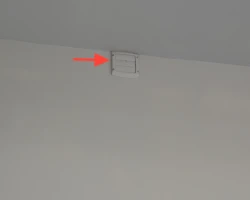 Dryer and bathroom exhaust ducts ending loose inside a garage instead of venting outdoors