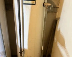 Water Heater – Beyond Service Life Data plate on an old Rheem Fury water heater showing a 1977 manufacture date
