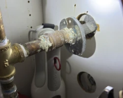 Copper to Galvanized – No Dielectric Fitting Copper water line joined directly to galvanized steel pipe with no dielectric union