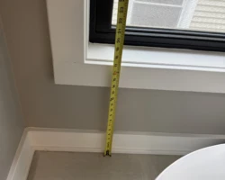 Interior window with a sill only 18 inches above the floor and a long drop outside