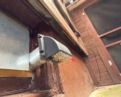 Screened exterior dryer vent cover matted with accumulated lint