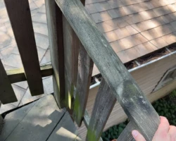 Wooden exterior stairway showing movement and loose connections at its supports